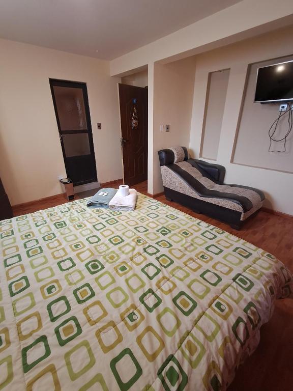 Postel nebo postele na pokoji v ubytování Hostal Nichkito