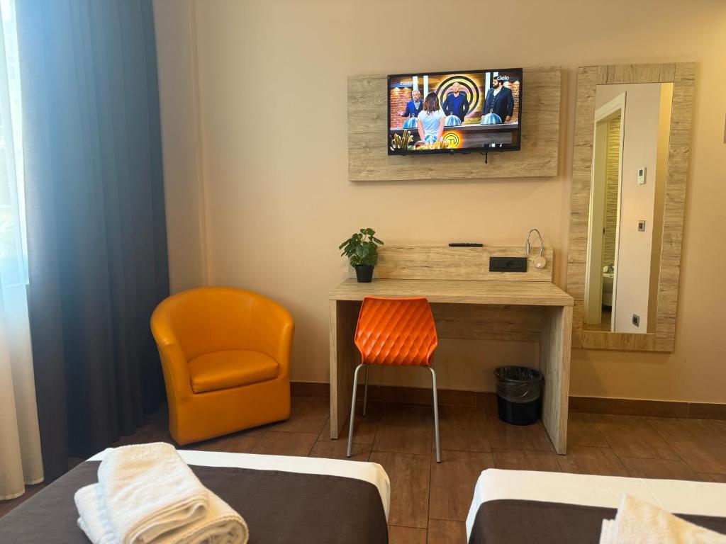 TV a/nebo společenská místnost v ubytování Hotel Giacosa