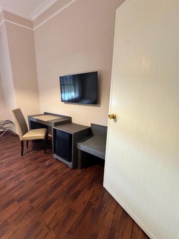 TV a/nebo společenská místnost v ubytování Grand Hotel Lamezia