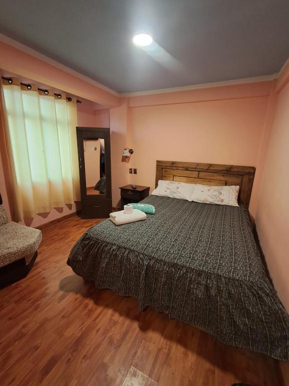Postel nebo postele na pokoji v ubytování Hostal Nichkito