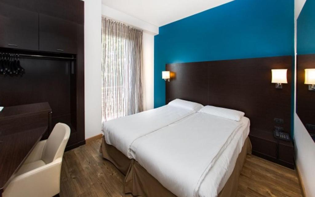 Postel nebo postele na pokoji v ubytování Hotel Bonotto