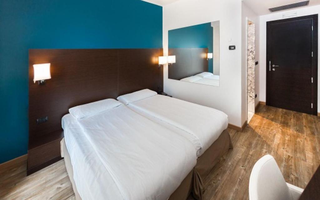 Postel nebo postele na pokoji v ubytování Hotel Bonotto