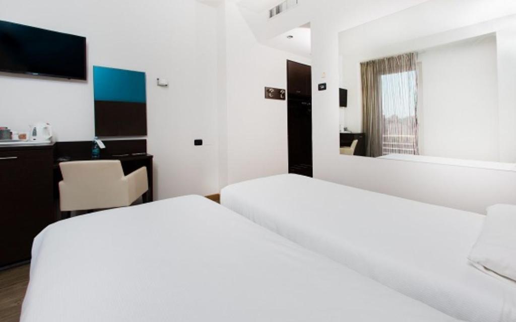 Postel nebo postele na pokoji v ubytování Hotel Bonotto