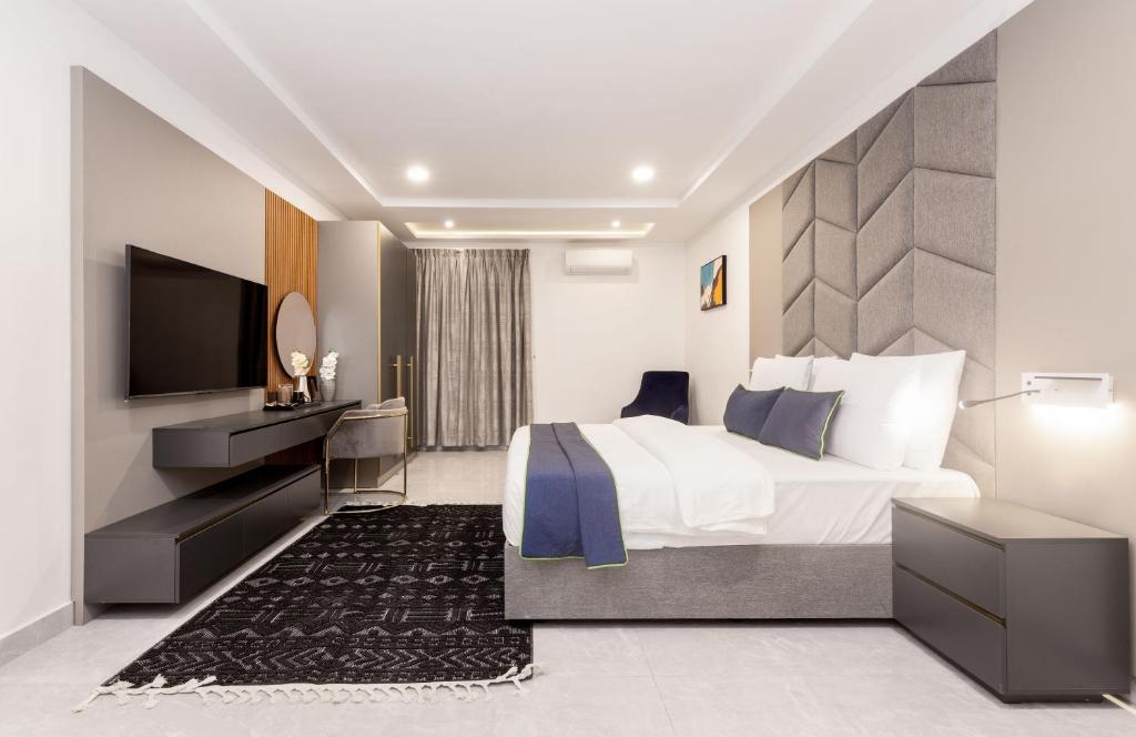 Ένα ή περισσότερα κρεβάτια σε δωμάτιο στο STP Apartments