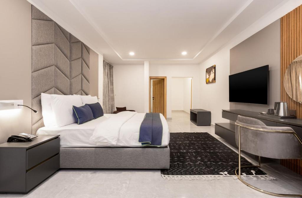 Ένα ή περισσότερα κρεβάτια σε δωμάτιο στο STP Apartments