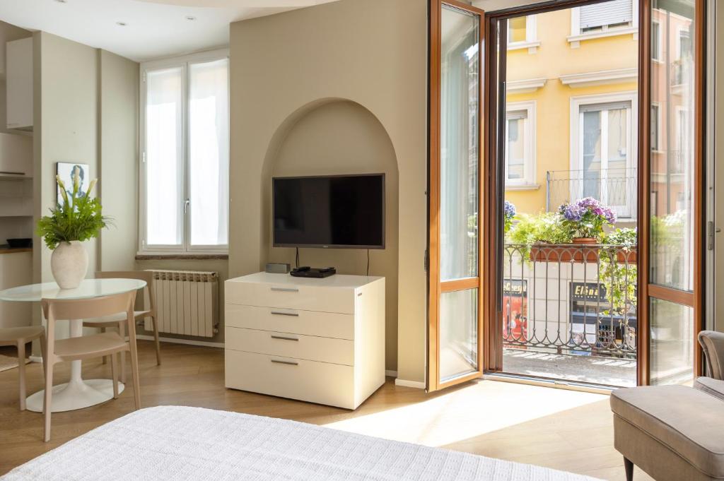 TV a/nebo společenská místnost v ubytování Suite Brera