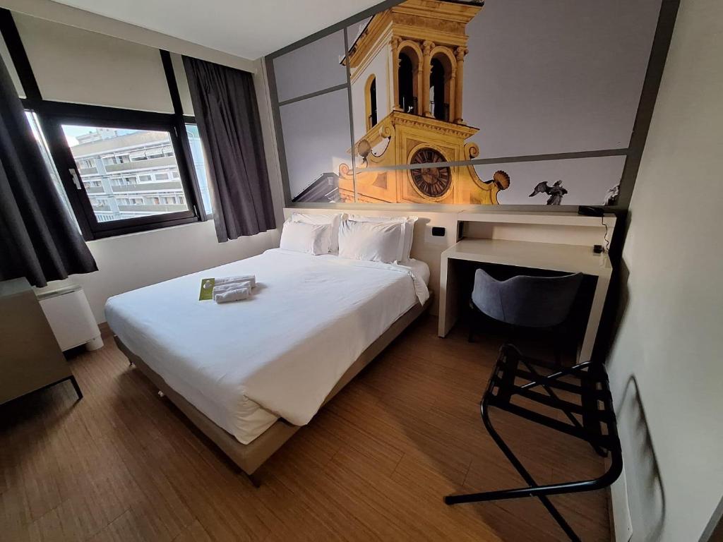 Postel nebo postele na pokoji v ubytování B&B Hotel Udine