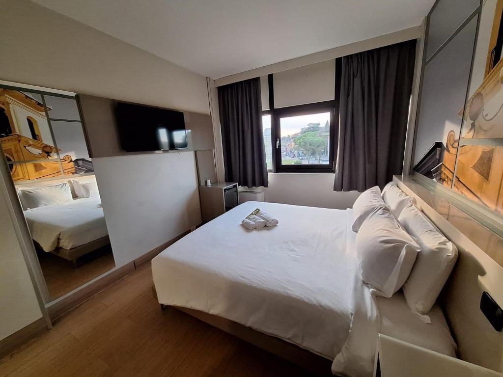 Postel nebo postele na pokoji v ubytování B&B Hotel Udine