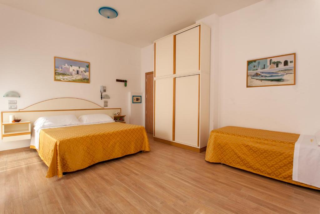 Postel nebo postele na pokoji v ubytování Hotel Vanni