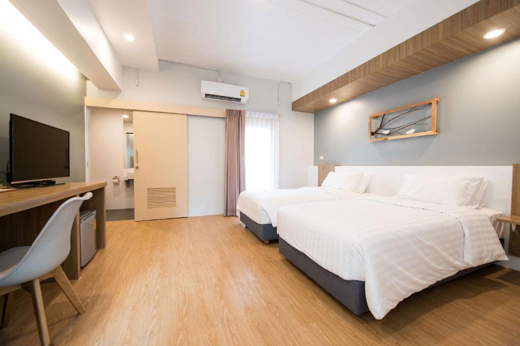 Postel nebo postele na pokoji v ubytování Shade House - Bitec Bangna