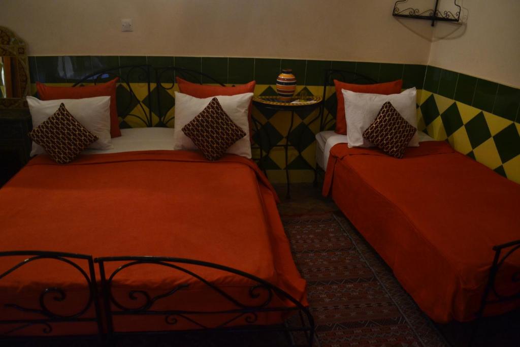 Postel nebo postele na pokoji v ubytování Riad Hôtel Belleville Marrakech