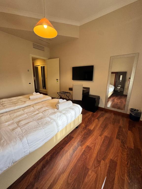 Postel nebo postele na pokoji v ubytování Grand Hotel Lamezia