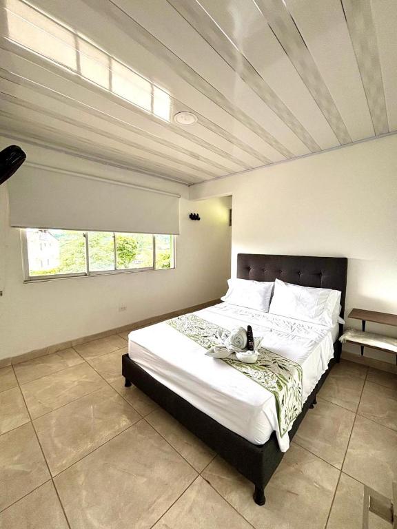 Postel nebo postele na pokoji v ubytování Ecohotel Alflo Inn