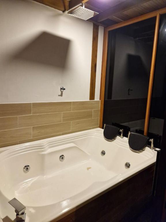 Koupelna v ubytování Ecohotel Alflo Inn
