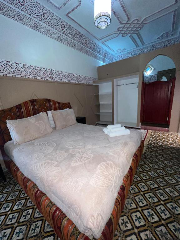 Postel nebo postele na pokoji v ubytování Riad La Perla Bianca