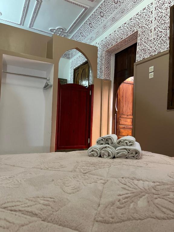 Postel nebo postele na pokoji v ubytování Riad La Perla Bianca