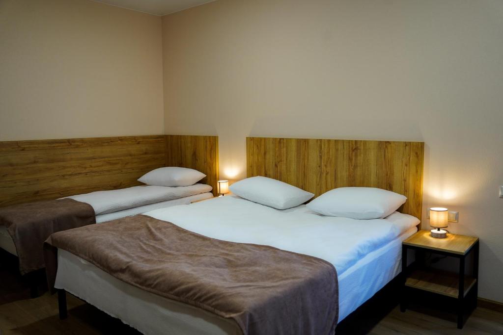 Letto o letti in una camera di Peak Hotel Kazbegi