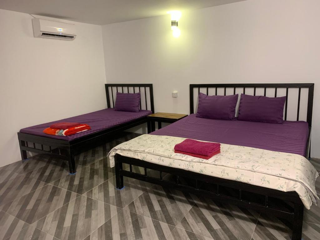 Postel nebo postele na pokoji v ubytování Maloop Cafe Hostel