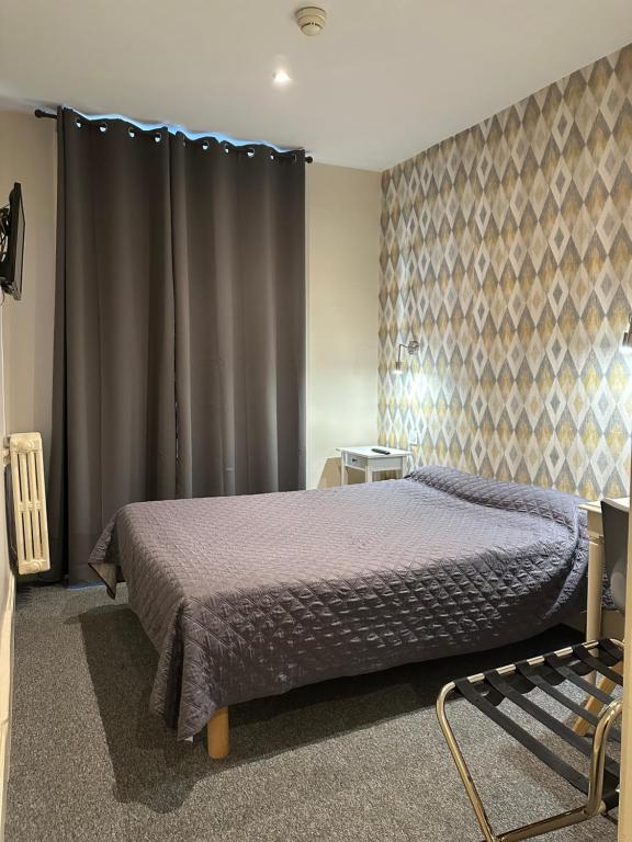 Postel nebo postele na pokoji v ubytování Hotel Azur