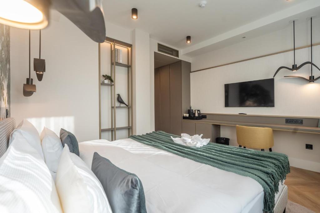 Voodi või voodid majutusasutuse Larum Balatonfüred - Adults only toas
