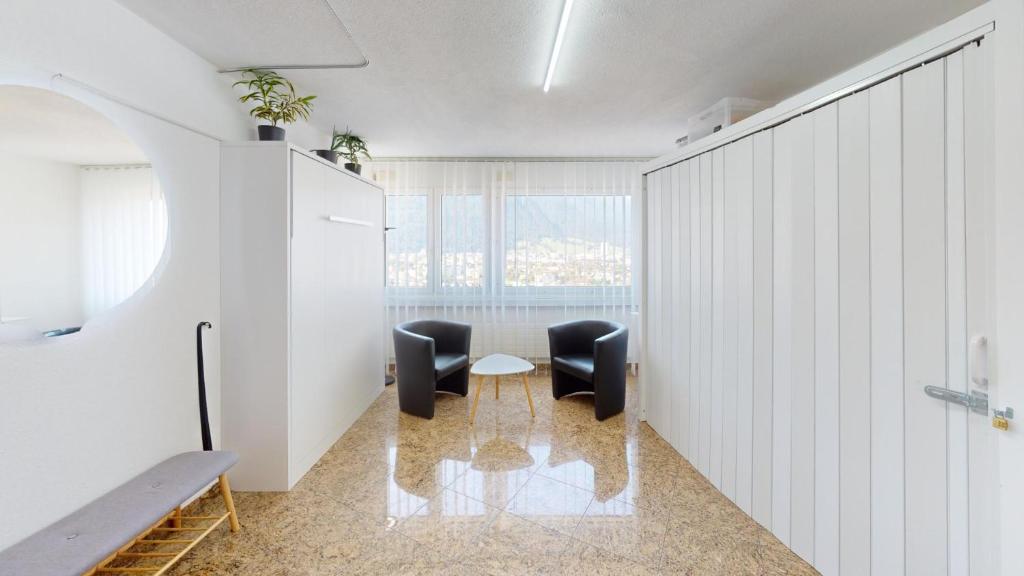 Posezení v ubytování Solution-Grischun Apartments - Berninaexpress - Städterip - atemberaubende Aussicht