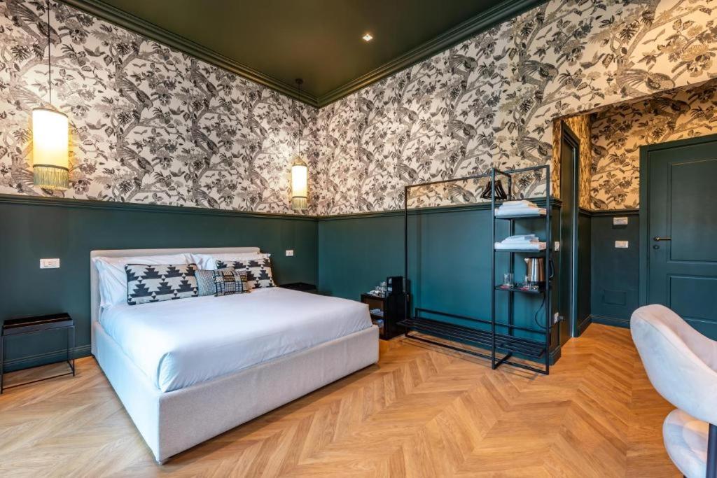 Postel nebo postele na pokoji v ubytování Voluta Suites