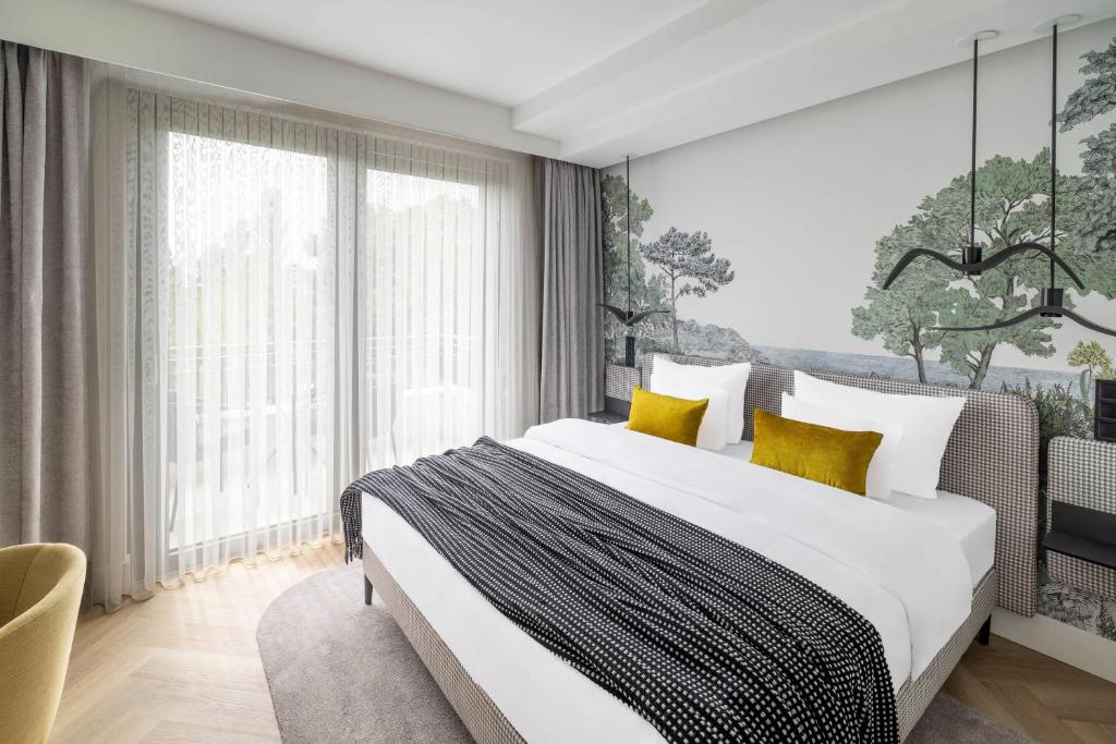 Voodi või voodid majutusasutuse Larum Balatonfüred - Adults only toas