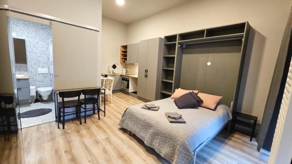 Postel nebo postele na pokoji v ubytování Reykjavík City Studio