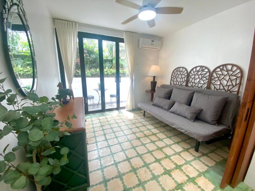a living room with a couch and a window at The Gallery House in Ulot