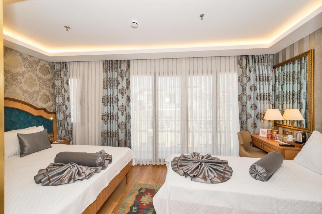 Postel nebo postele na pokoji v ubytování Aprilis Gold Hotel - Special Category
