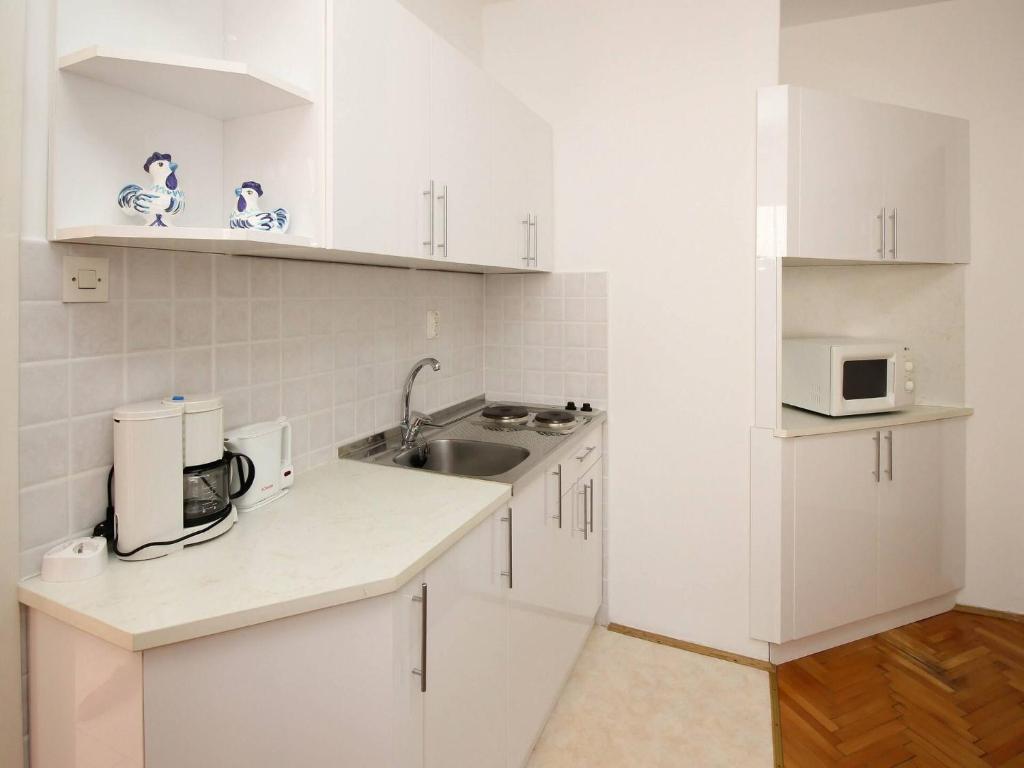 Kuchyň nebo kuchyňský kout v ubytování Apartments Dragica