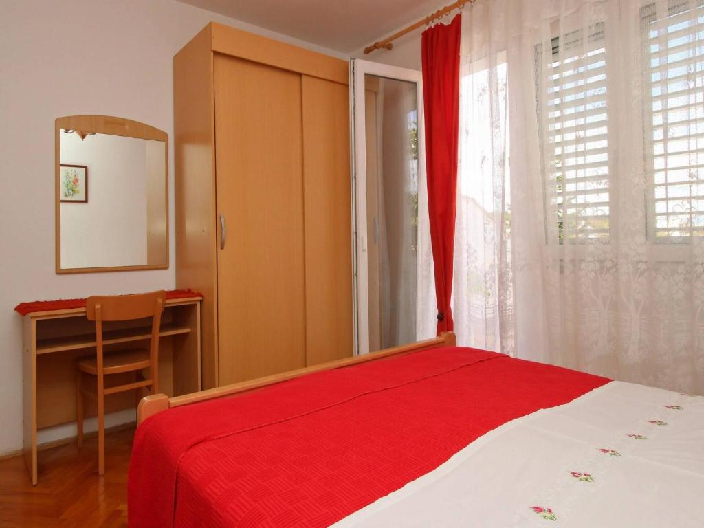 Postel nebo postele na pokoji v ubytování Apartments Dragica