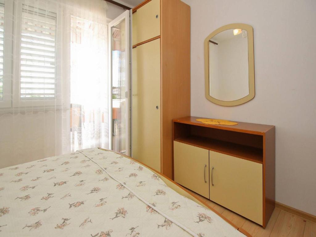 Postel nebo postele na pokoji v ubytování Apartments Dragica