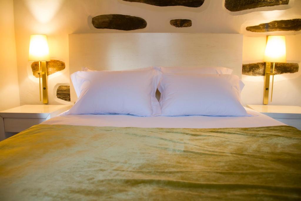 Uma cama ou camas num quarto em Refgios do Pinhal