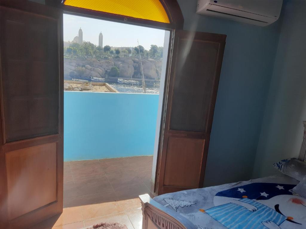 Postel nebo postele na pokoji v ubytování Malika nubian house