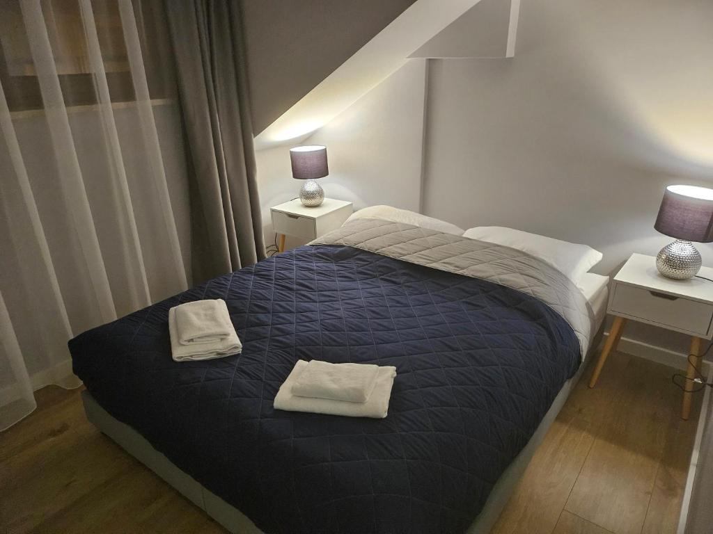 Postel nebo postele na pokoji v ubytování Aparthotel Warszawa