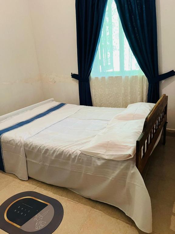 Postel nebo postele na pokoji v ubytování Meeyan Ella Rest