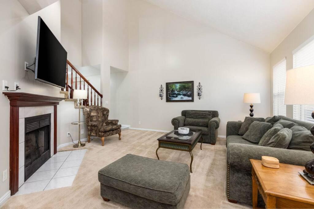 a living room with a couch and a fireplace at Clover Spring Wasatch Refuge in Cottonwood Heights