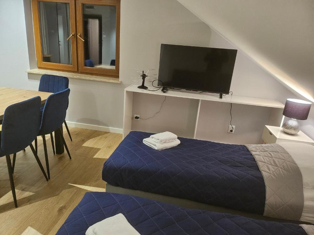 Postel nebo postele na pokoji v ubytování Aparthotel Warszawa