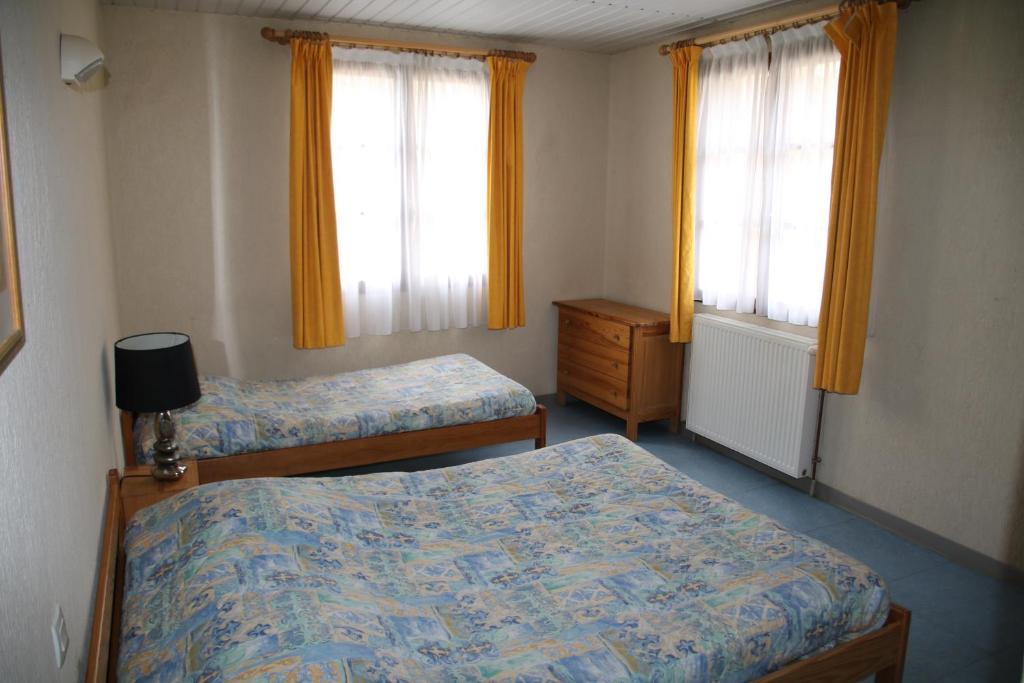 Una cama o camas en una habitación de Gite d'Etape Ascou La Forge