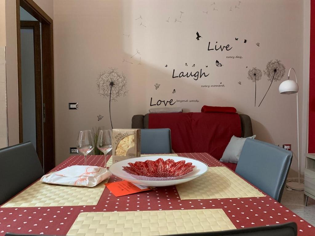 a dining room table with a plate on top of it at Scarlett 22 - Intero appartamento, centro città, free wifi in Carbonia