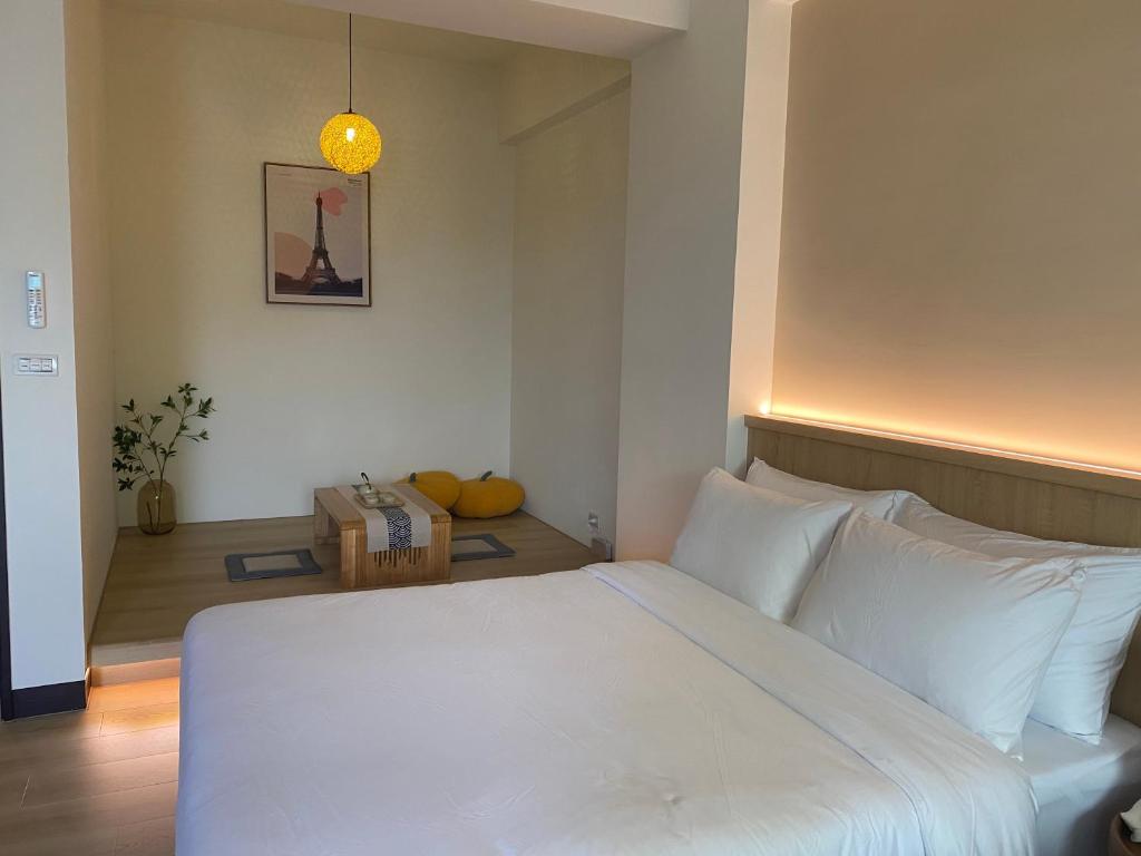 Postel nebo postele na pokoji v ubytování Orange Homestay