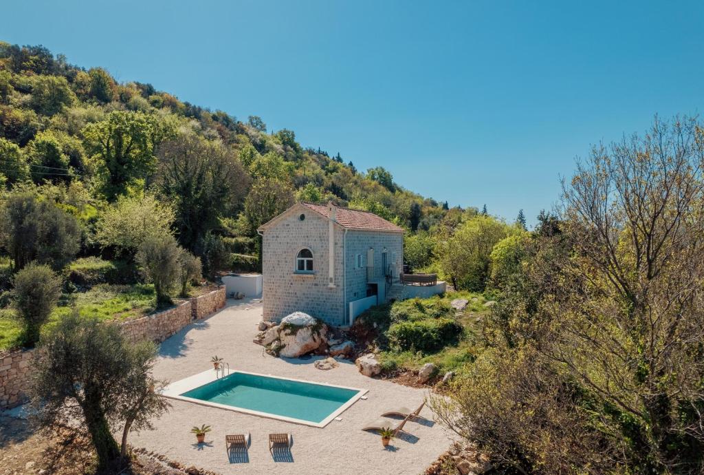 an aerial view of a villa with a swimming pool at Villa Magic Stone in Šišići