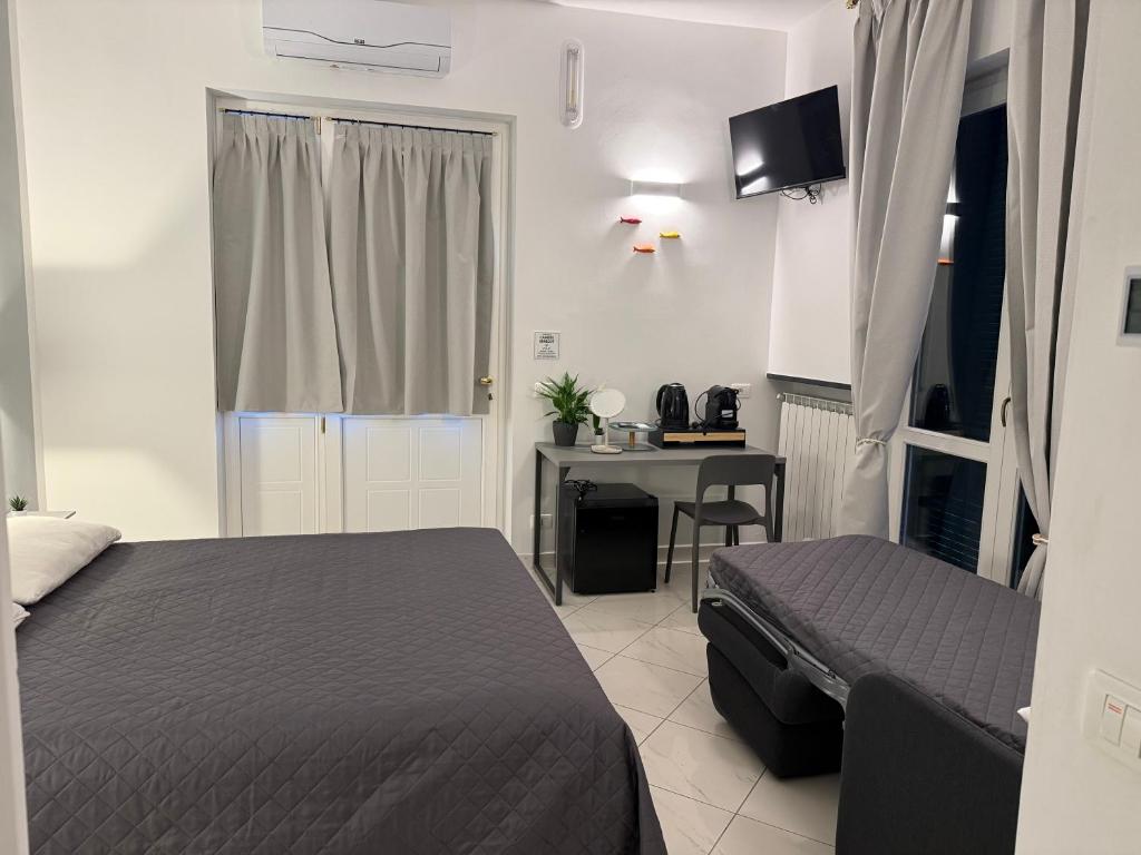 Postel nebo postele na pokoji v ubytování Camere Margot