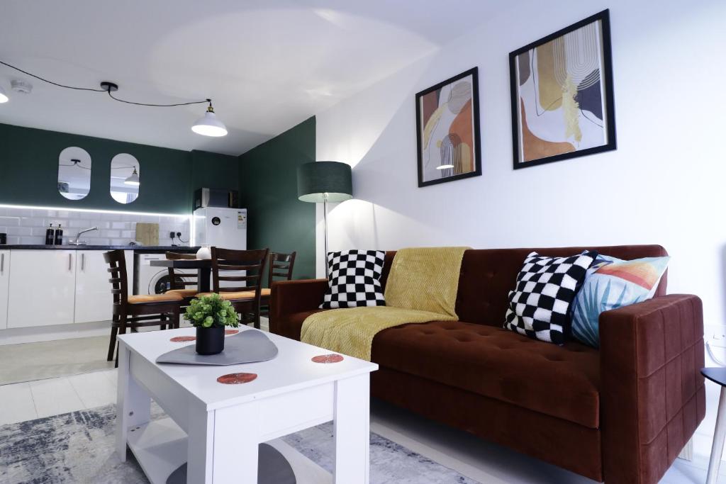 a living room with a couch and a table at listing SALE - Entire Town Centre Apartment Free Parking WiFi in Colchester