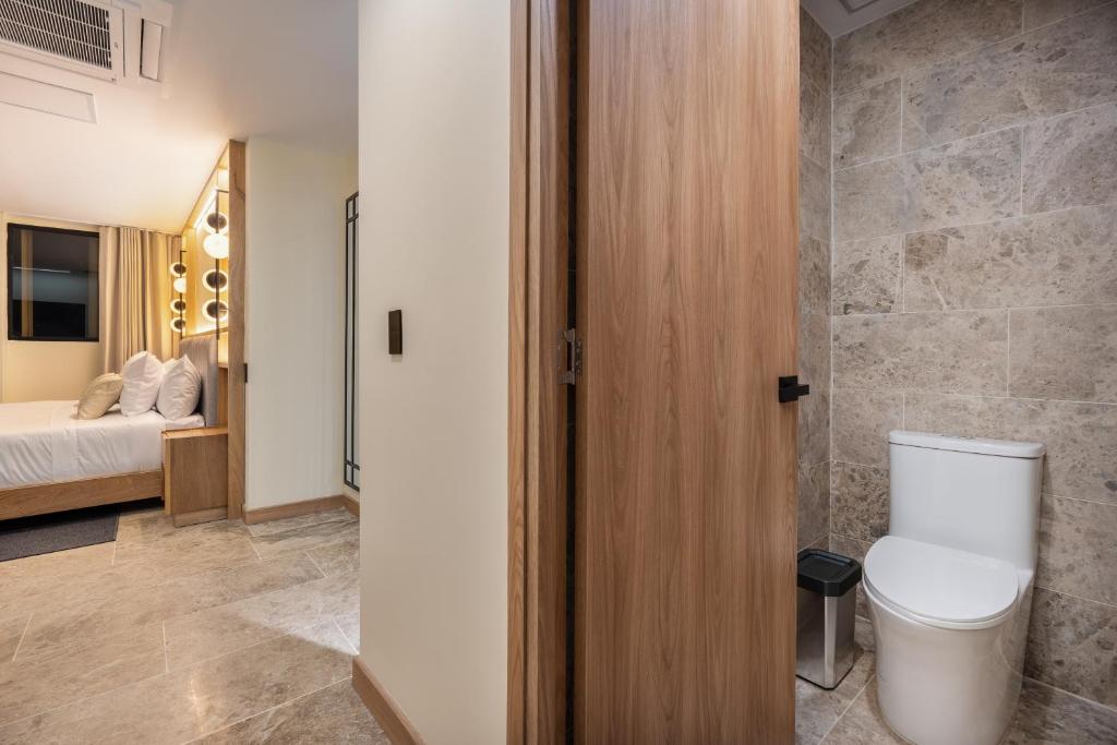 Postel nebo postele na pokoji v ubytování LIN Boutique Hotel by HOUSY HOST