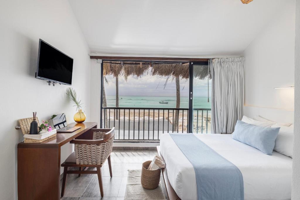 Postel nebo postele na pokoji v ubytování Areia Playa del Carmen - Beach Front Hotel