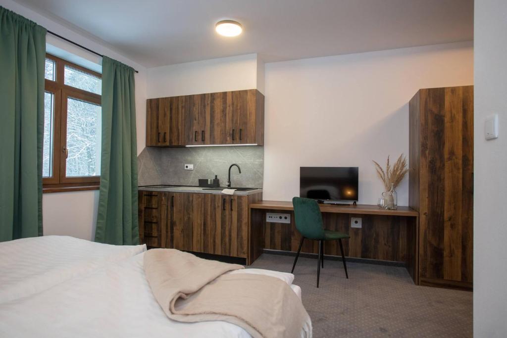 Postel nebo postele na pokoji v ubytování Wellness Hotel Zavadilka