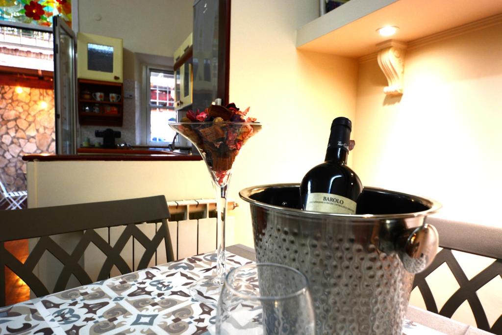 a bottle of wine in a bucket on a table at Vicolo 35 in Rome