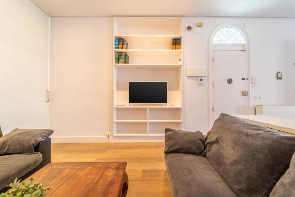 Televízia a/alebo spoločenská miestnosť v ubytovaní LovelyLoft Altamira Duplex